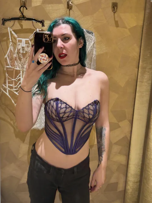 Fitting room selfie in purple