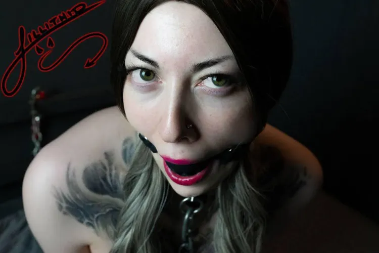 A black gag is the perfect accessory for these seductive red lips.