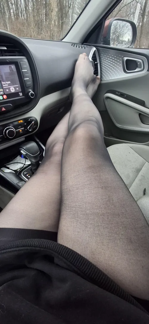 Long shaved smooth legs in the car