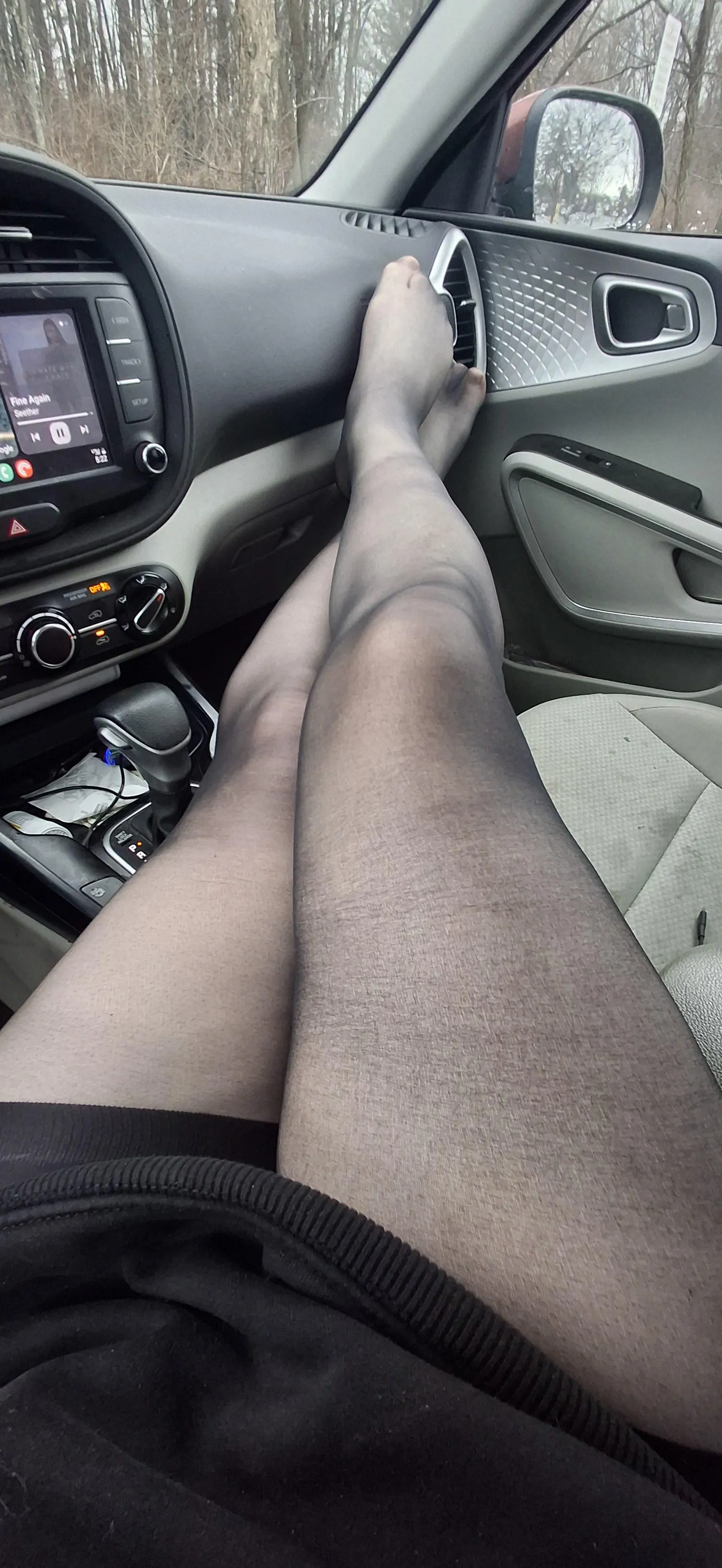 Long shaved smooth legs in the car