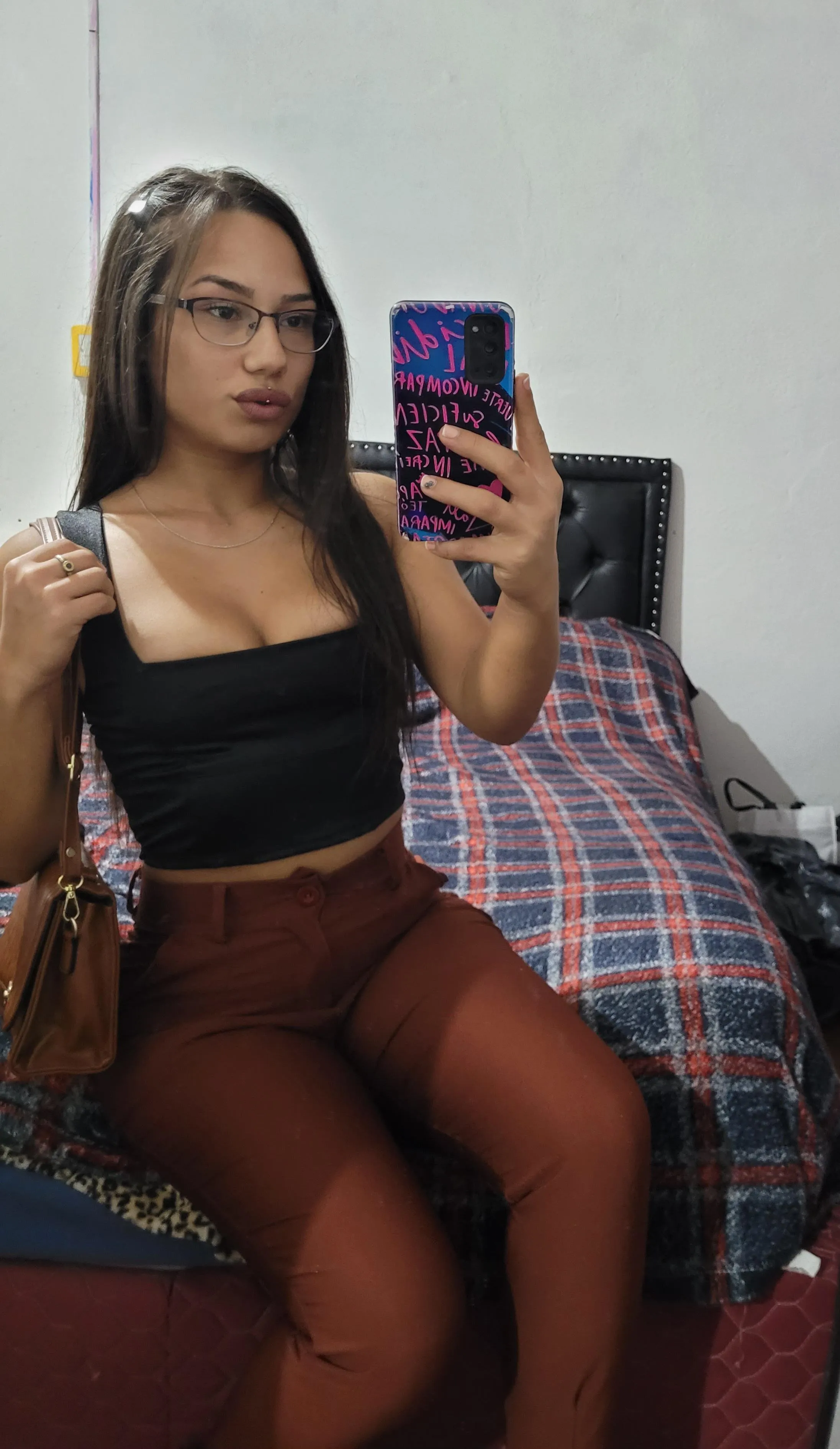 The glasses give her the touch of a ...