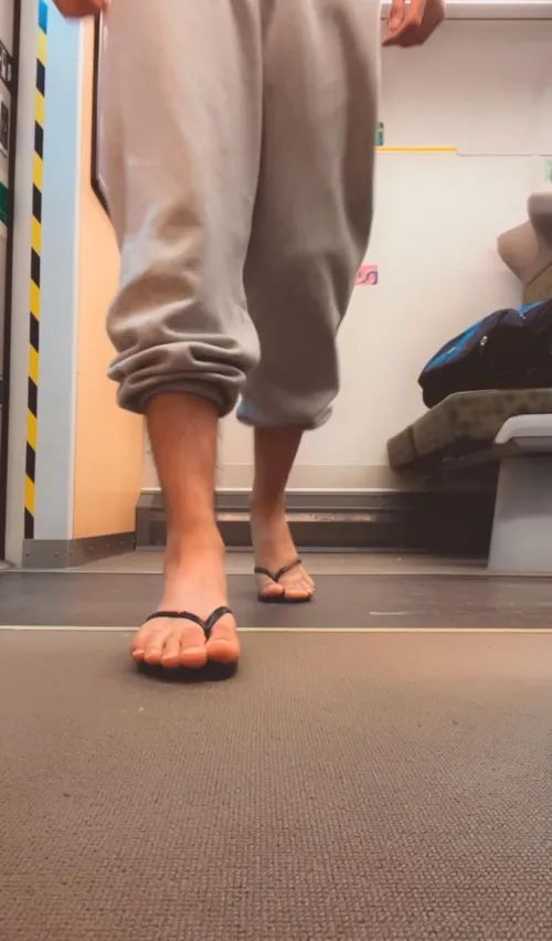 [Request] Show off your feet in the train in flip flops and capri sweats