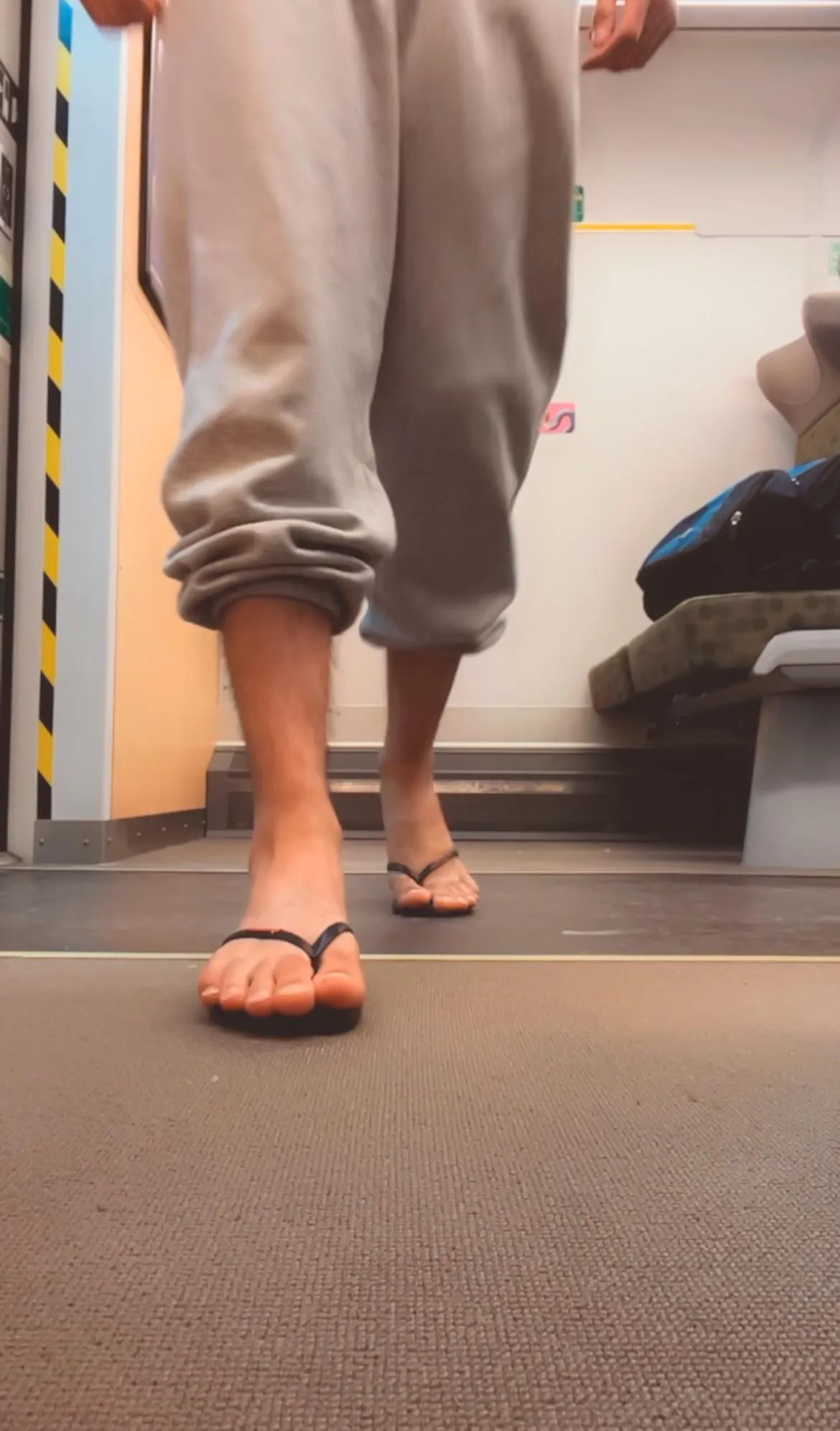 [Request] Show off your feet in the train in flip flops and capri sweats