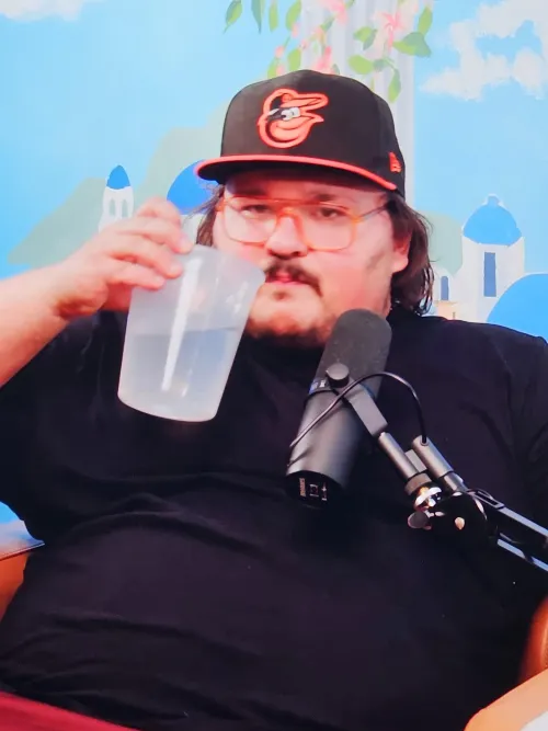 Stav drinks water from a soup takeout container