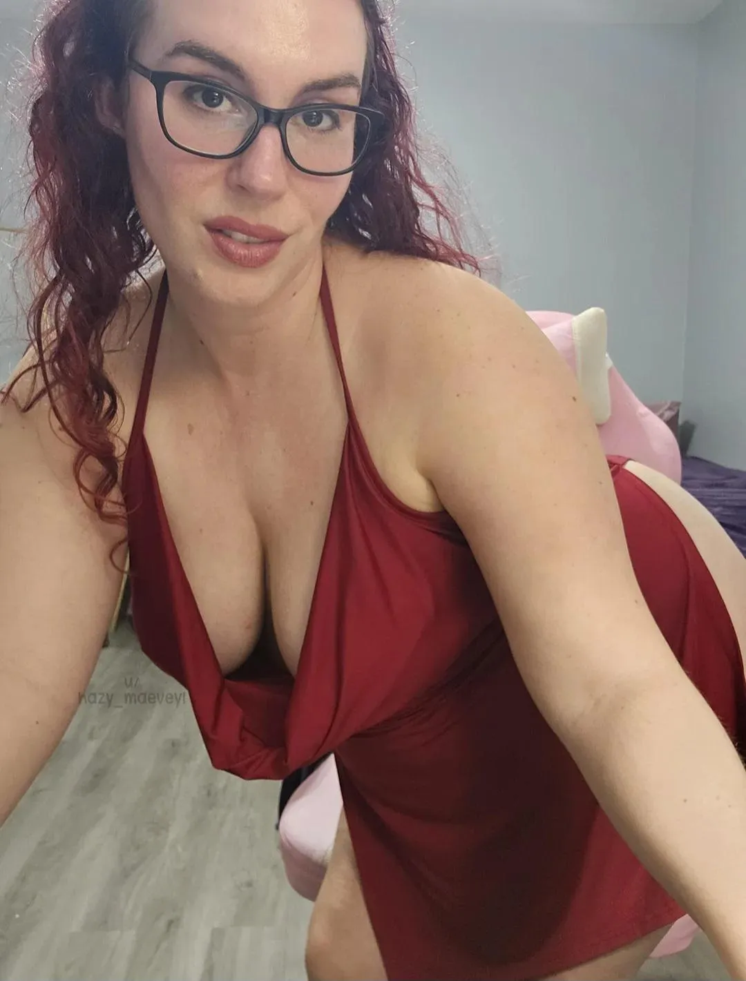 Glasses and no bra under this red dress