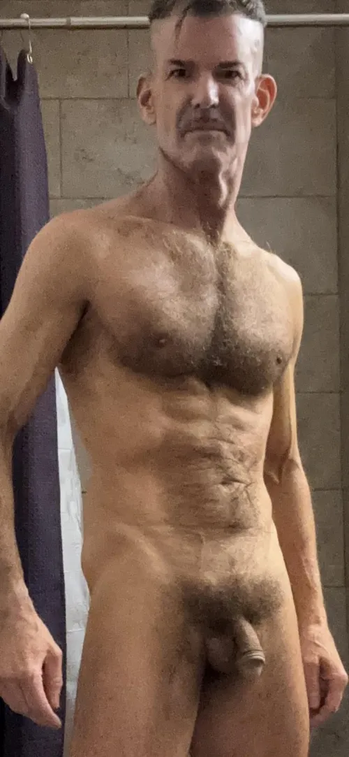 Dressed appropriately for Men’s Locker after shower and workout.