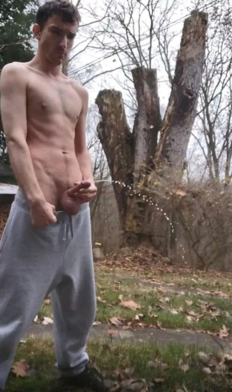Shirtless pic outside pissing