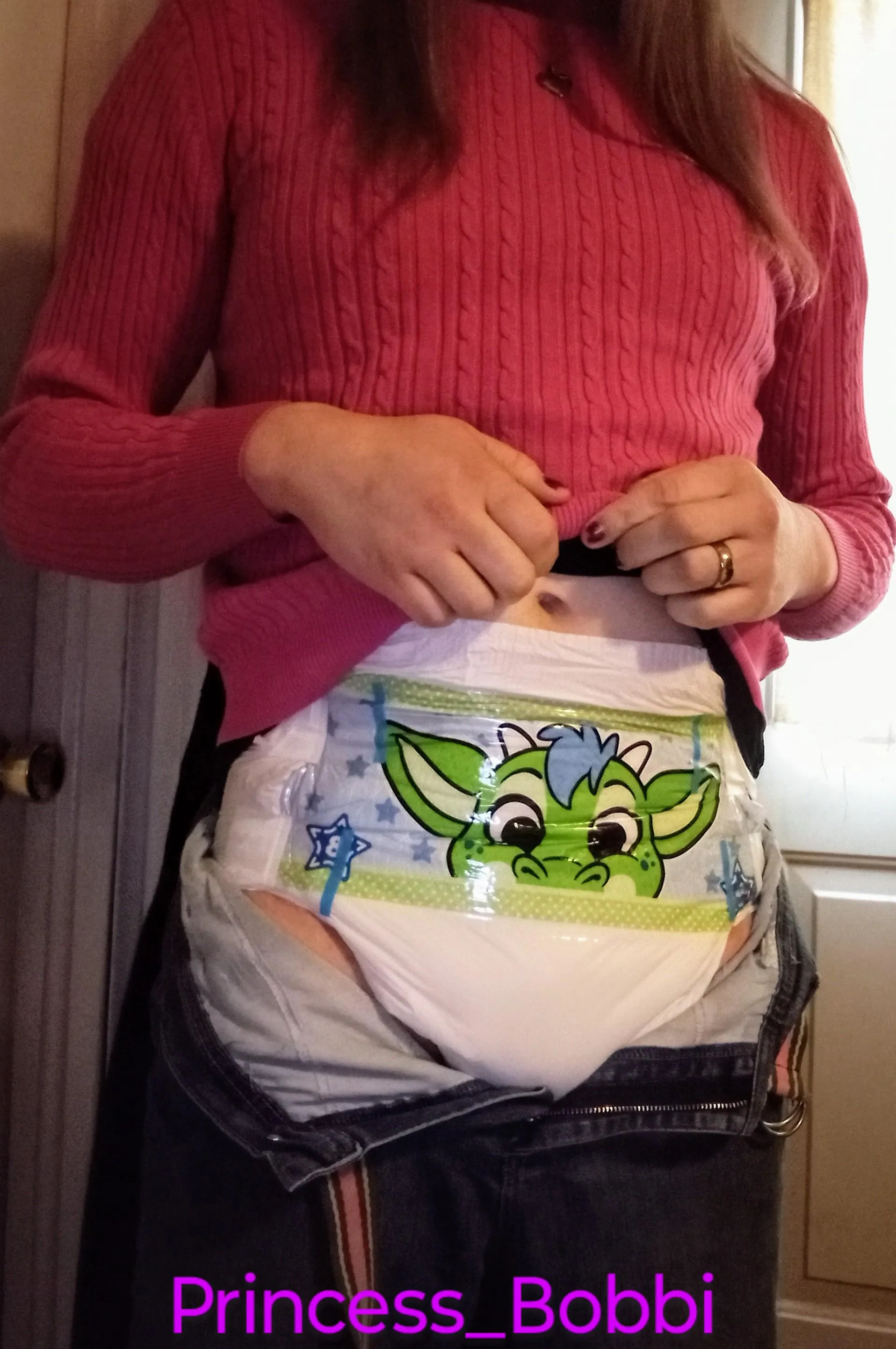 You'd never even guess that there's a crinkly dragon under her clothes, because she can't keep herself dry.