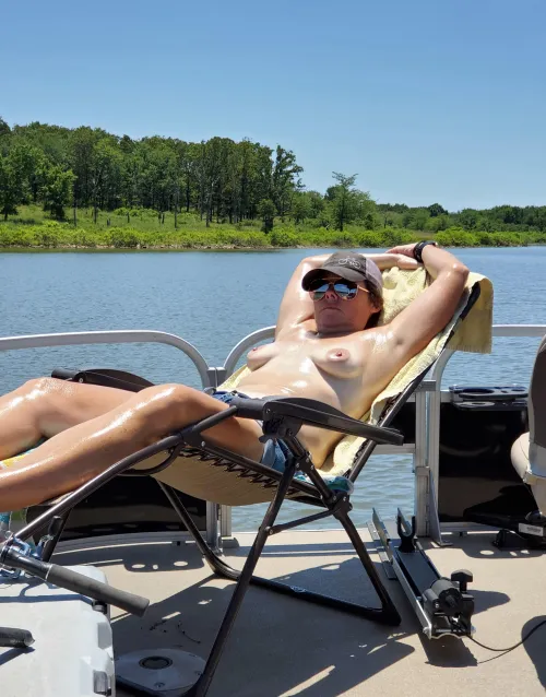 Shes working on her tan while the sun is out