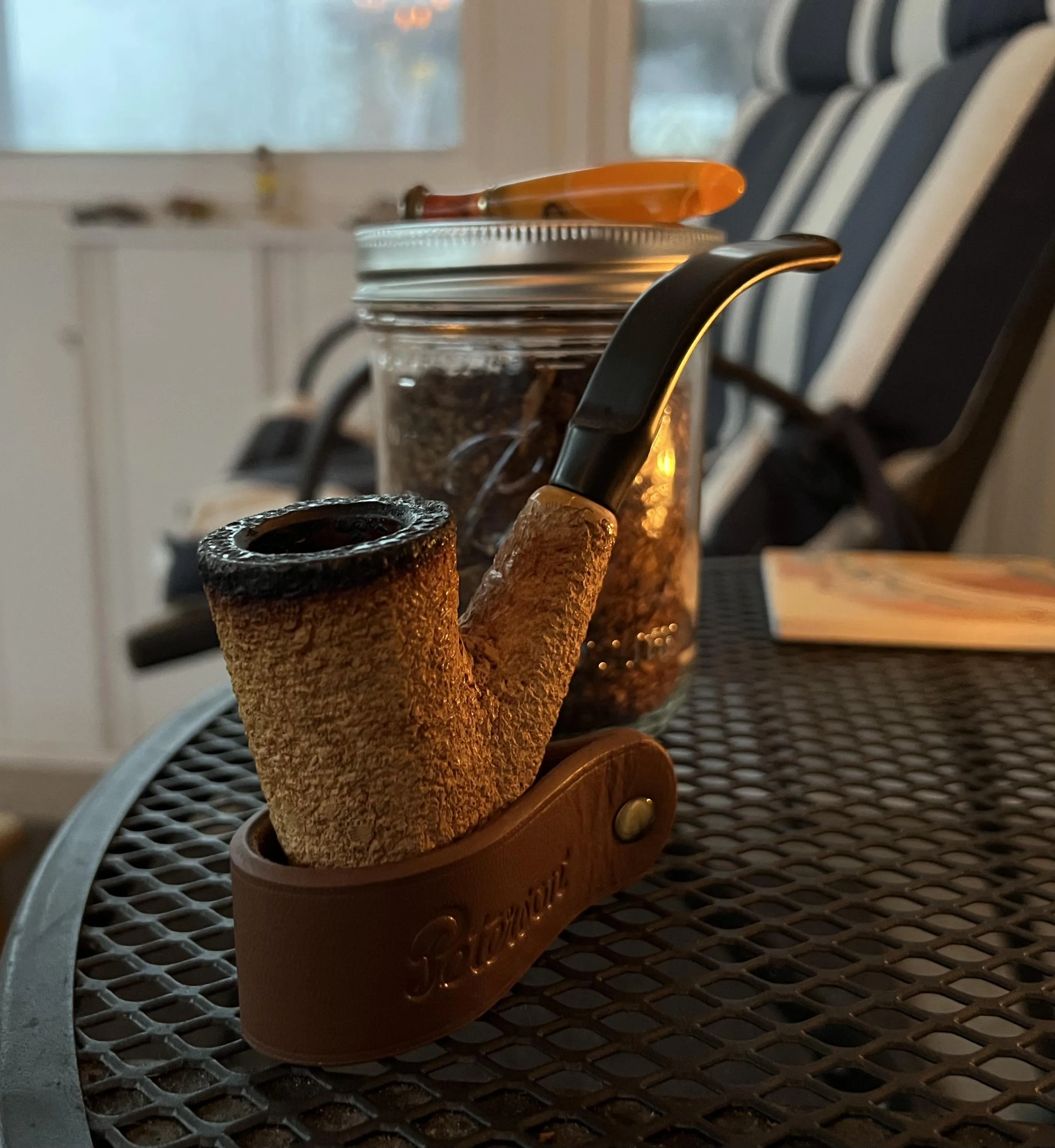 Watching the wind, lightning, hail, and rain from my front porch. The pipe is a Kiko meerschaum and the tobacco is Maple Shadows II