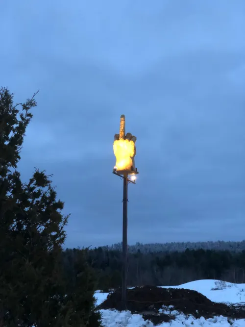 A man in Vermont has got a warning because of him trying to enter his own house so he made this and placed it on a pole to show his opinion on the whole town