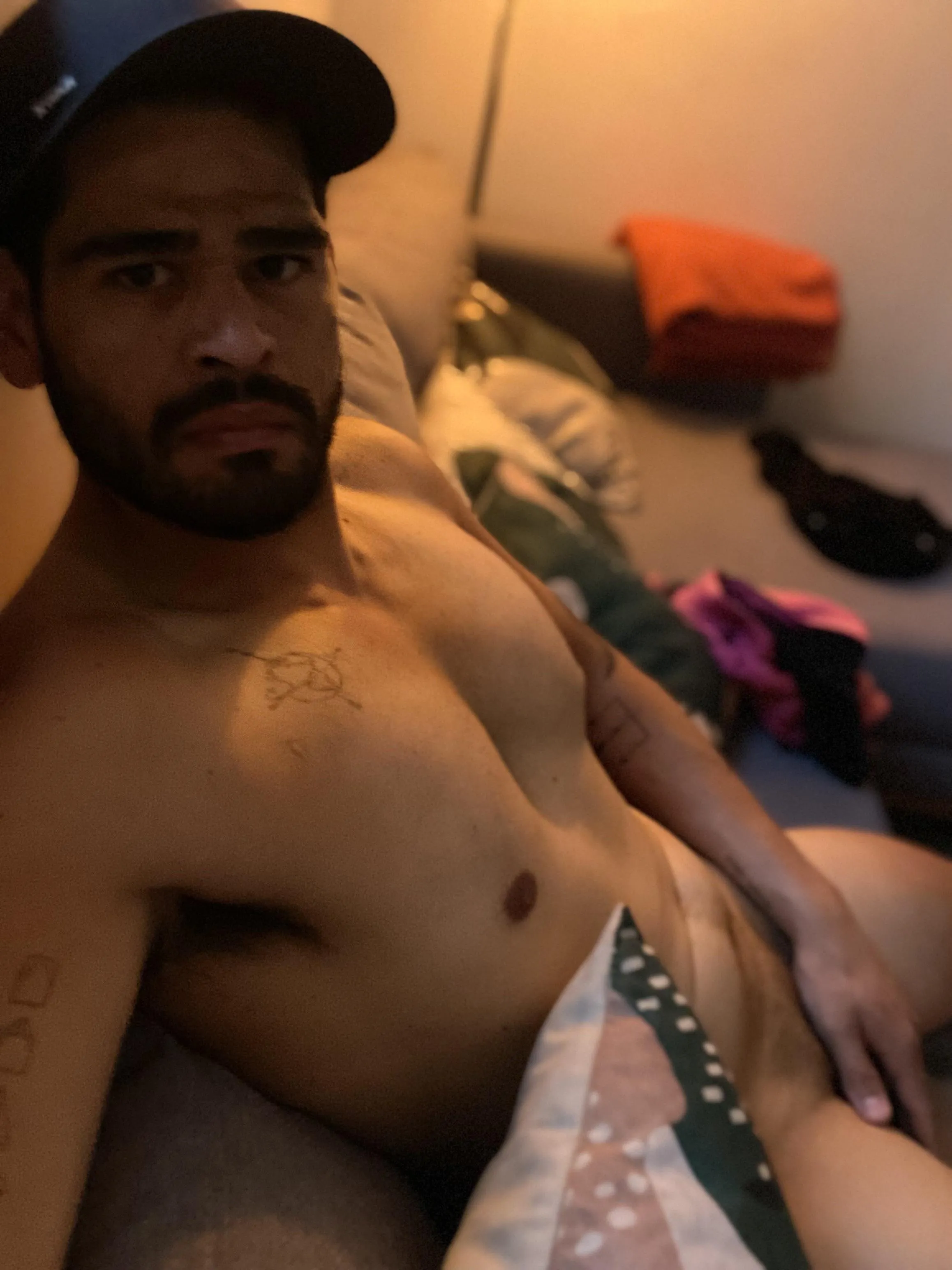 Caught me lounging half-naked… should I get more comfortable? 😏