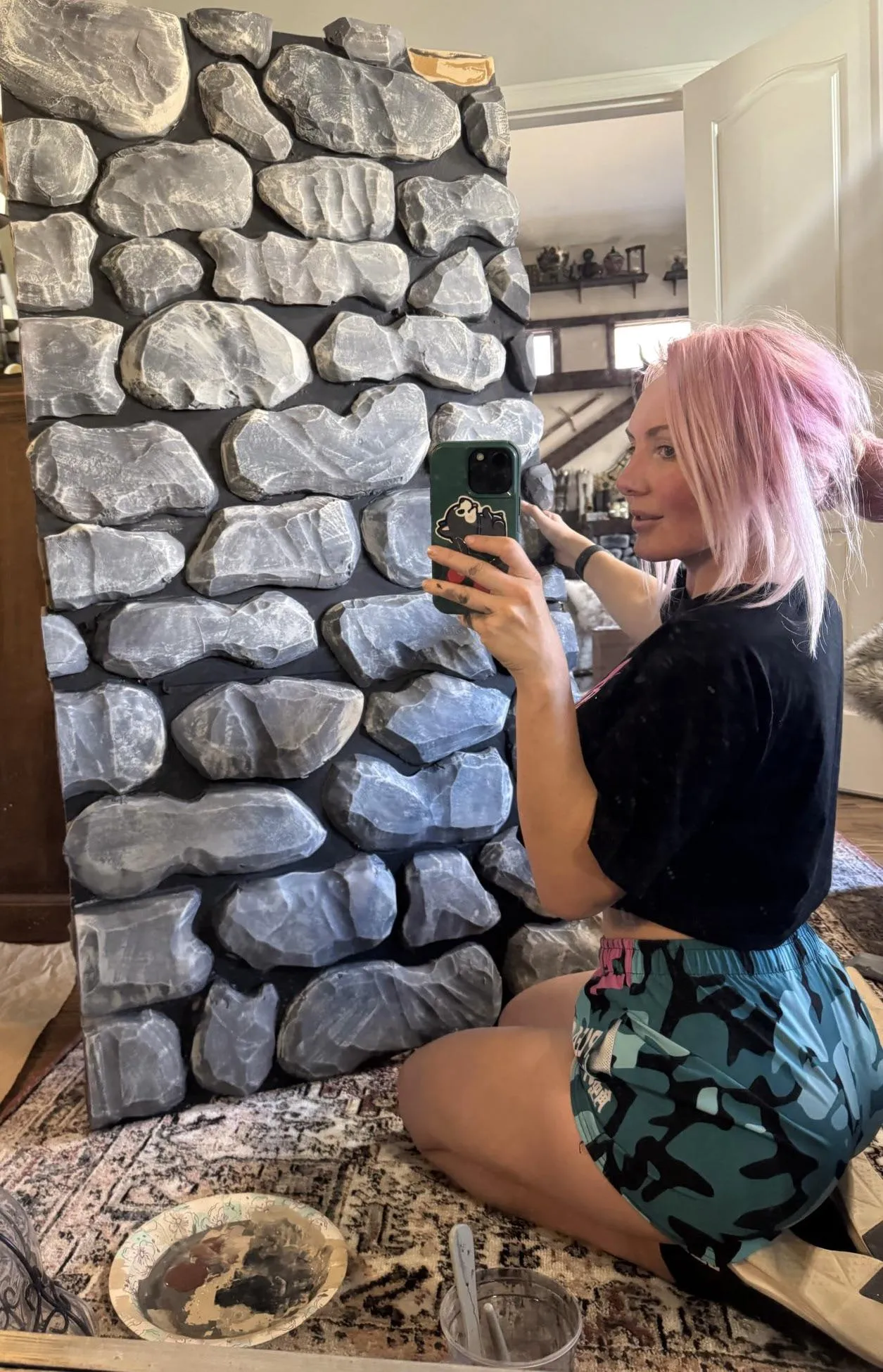 ‘While our foster pup sleeps I work on my rock wall!’