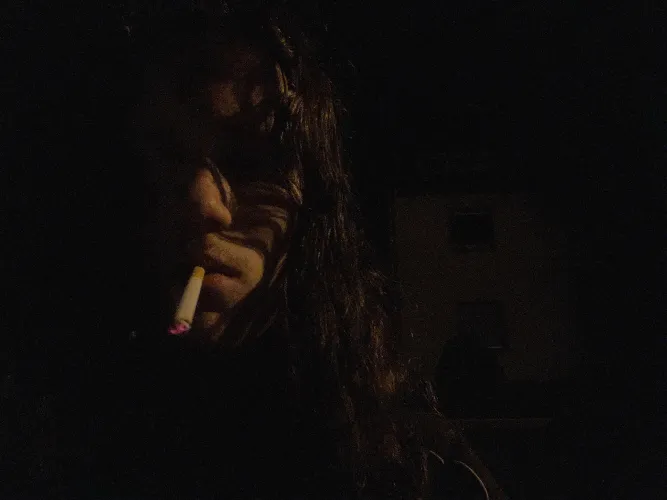 Enjoying a classic Marlboro red on a dark night