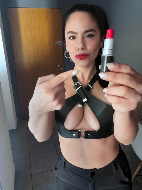 Glossy lipstick, quivering lips: feminist made to serve