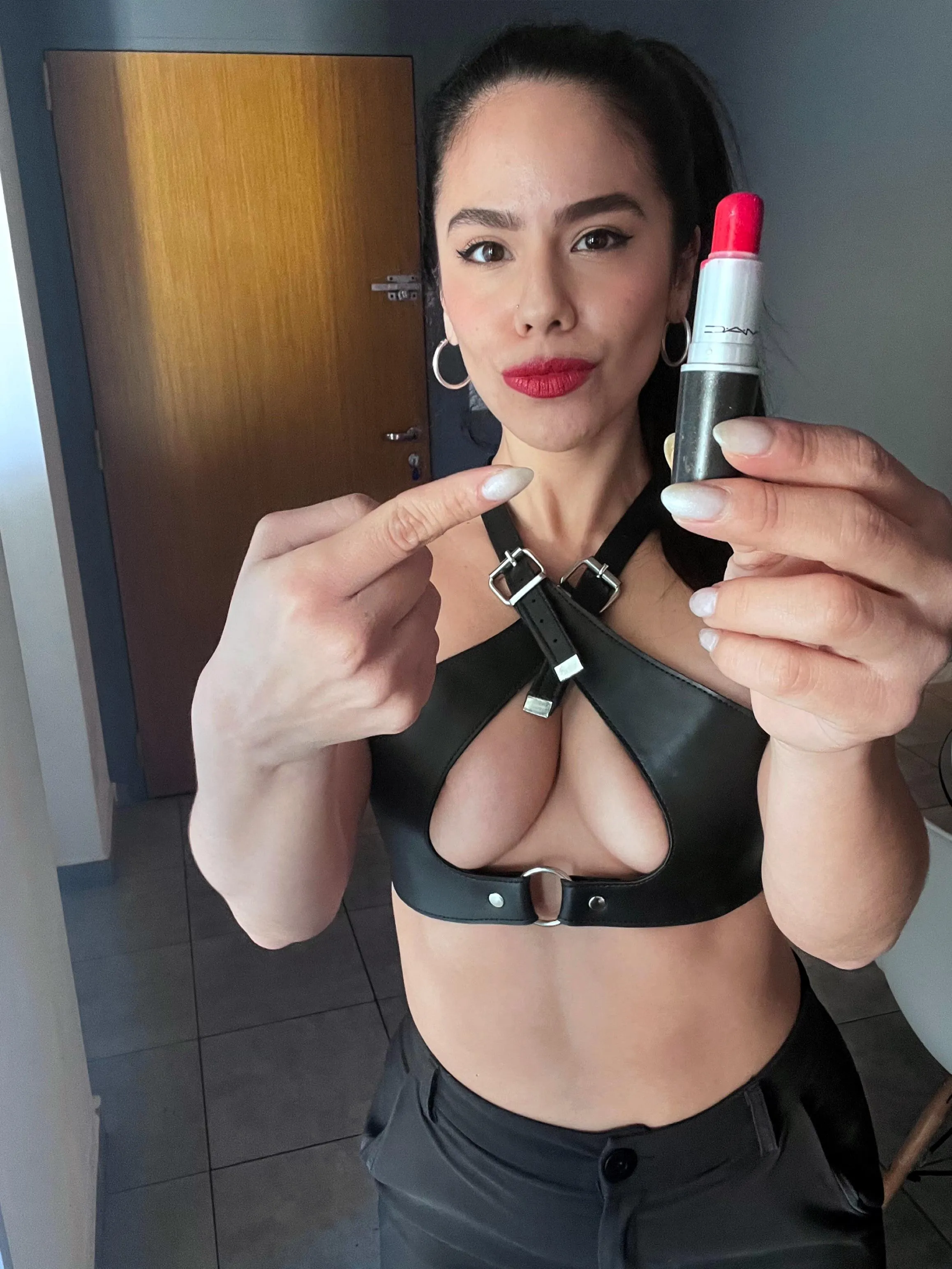 Glossy lipstick, quivering lips: feminist made to serve