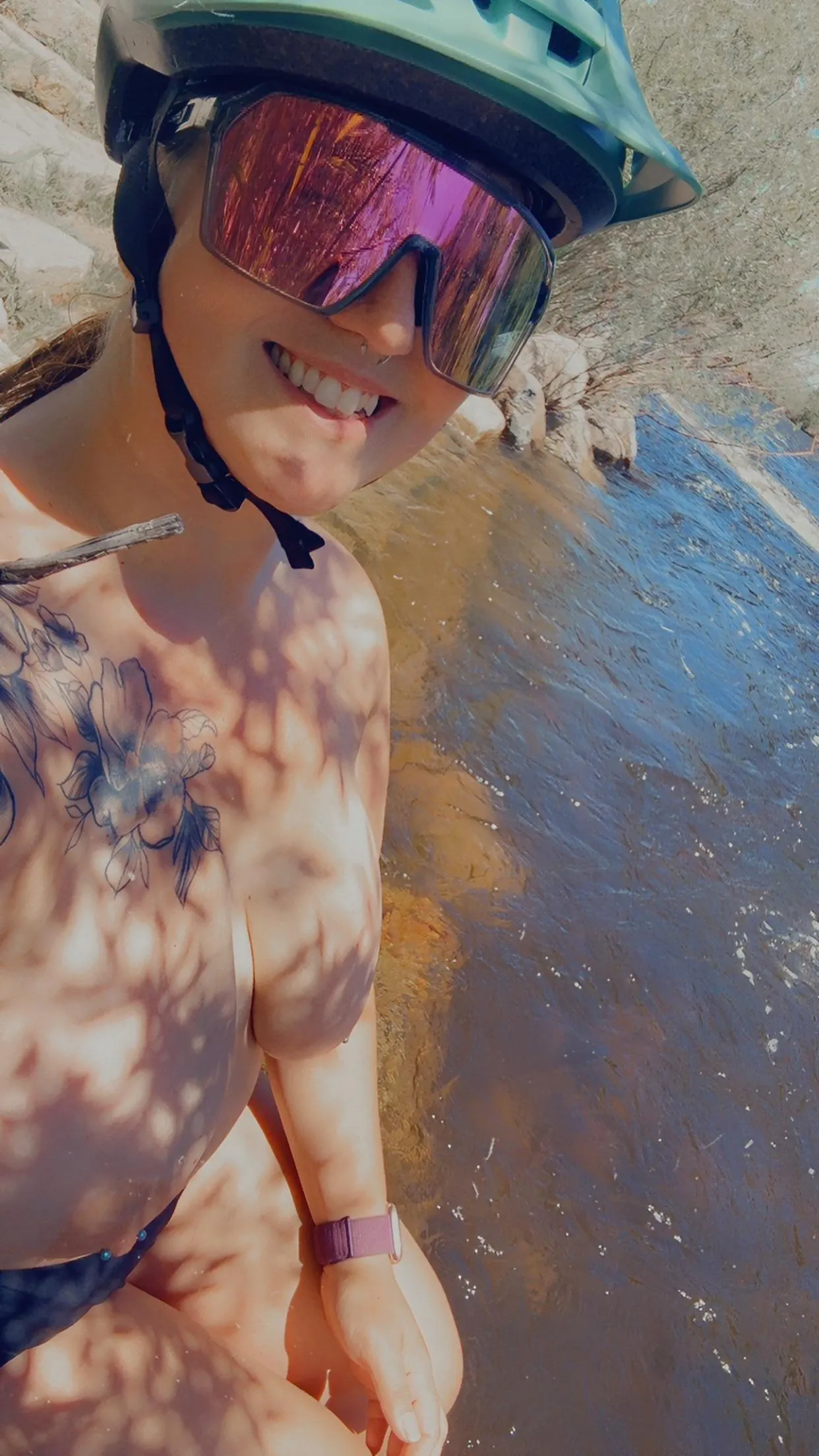 Hanging out topless by the river