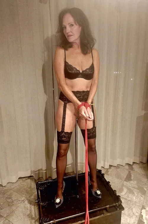 Displayed in rope Bondage on the steel prison pole ...