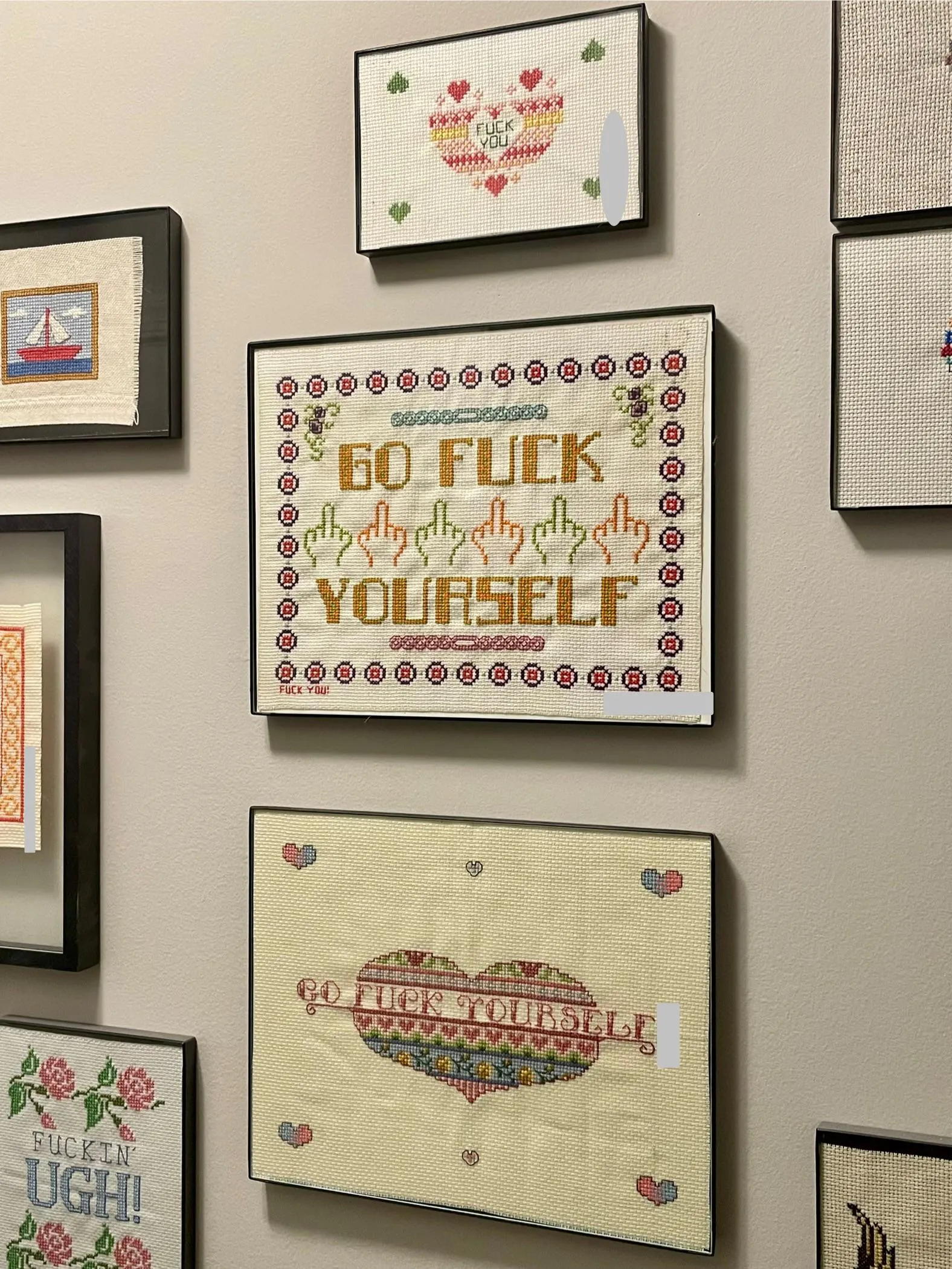 My uplifting wall of cross stitches!