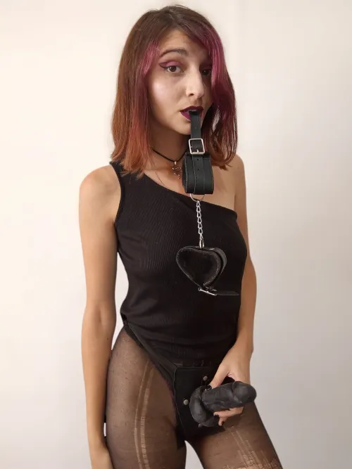 Just seeing this must make your little clit twitch.The cuffs in my mouth, the strap I’ll never use on a man… Only on pathetic little things like you. Because that’s what you were made for — To kneel. To gag. To be used and forgotten.