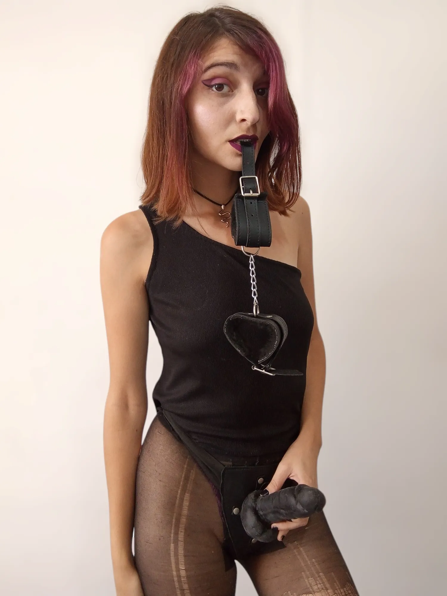 Just seeing this must make your little clit twitch.The cuffs in my mouth, the strap I’ll never use on a man… Only on pathetic little things like you. Because that’s what you were made for — To kneel. To gag. To be used and forgotten.