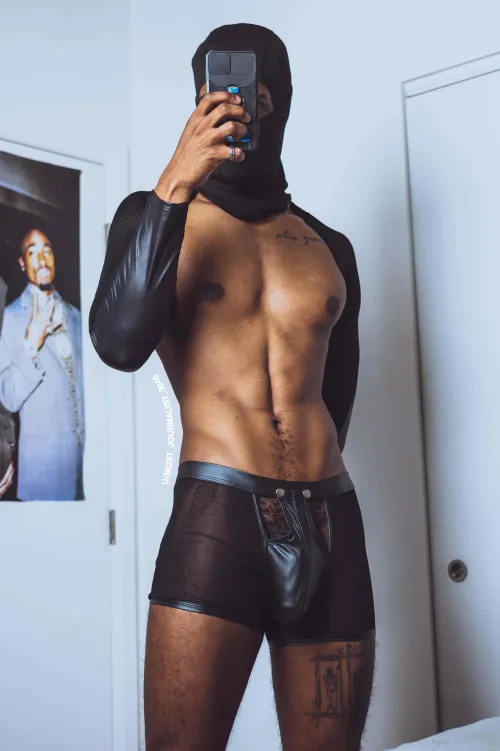 Leather arms. Lace briefs. BLACKED energy.