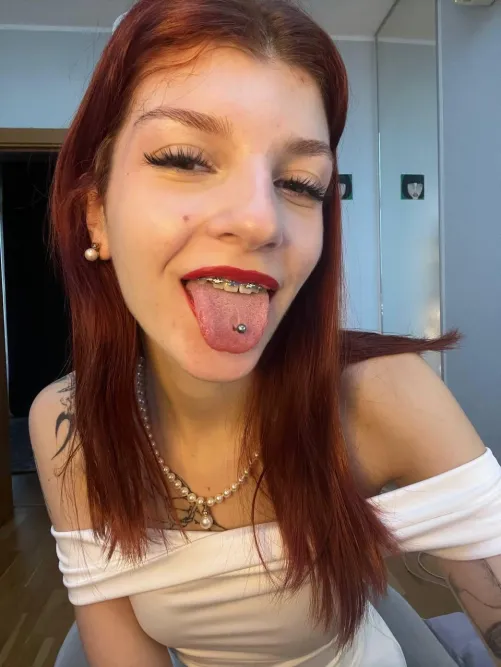 tongue out, braces kinda stealing the whole mood