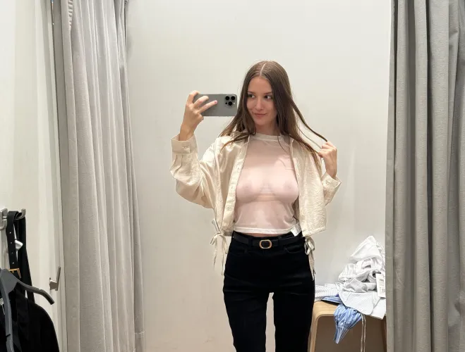 Caught in the changing room wearing only a see-through top that leaves nothing to imagination