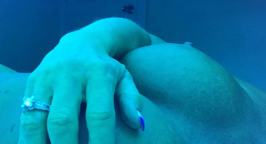Showing off my ring in the tanning bed.