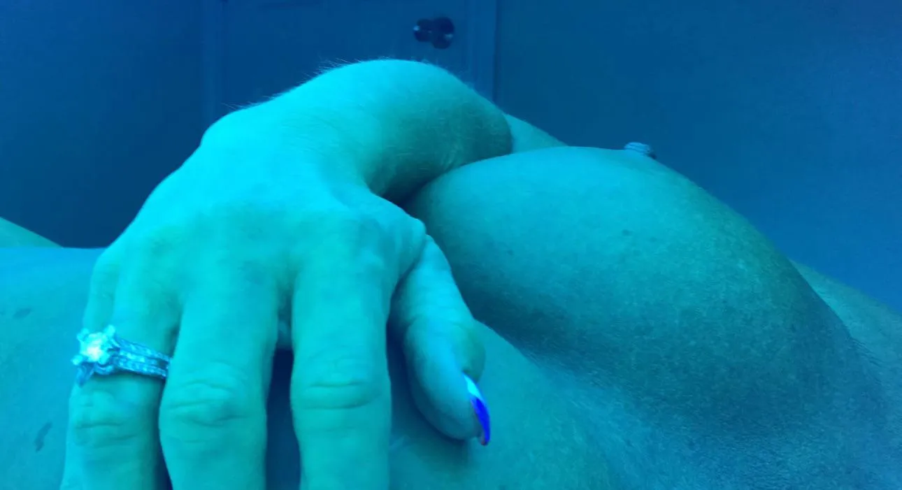 Showing off my ring in the tanning bed.