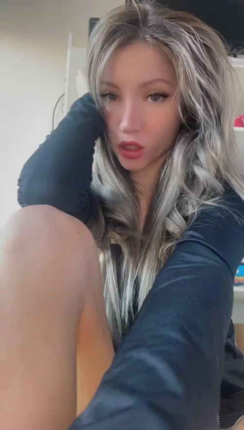 Blue sweater, no bra. Guess what’s showing?