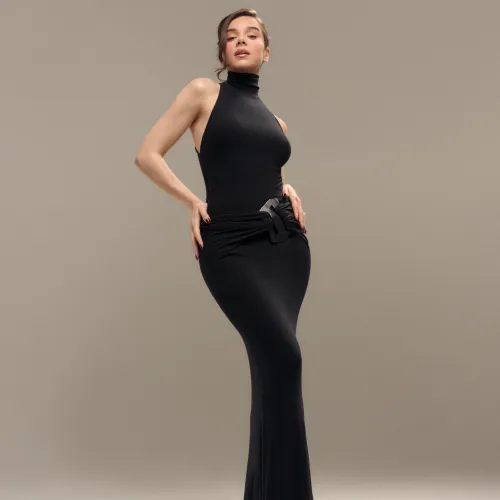 Hailee in a form fitting black dress