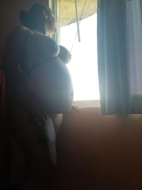 Watching the neighbors through the window.