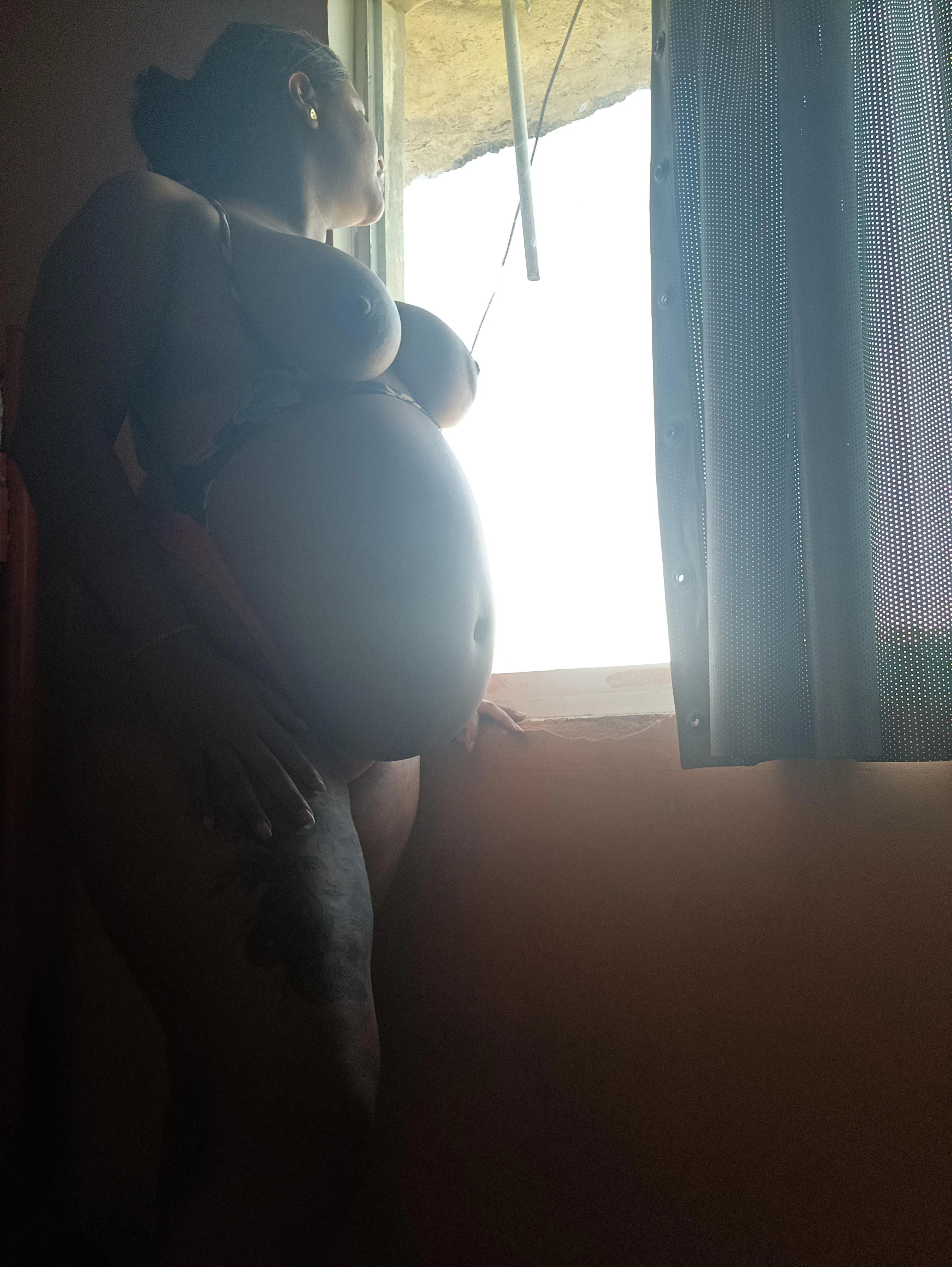 Watching the neighbors through the window.