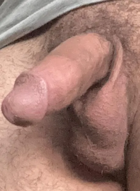 18M my left testicle hangs way much lower than my right one, is that normal?