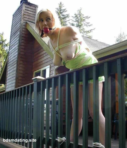 Helpless beauty, tied to the terrace