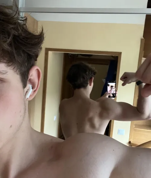 Do my rear delts look proportionate to the rest of my physique, or should I change my training approach for them?