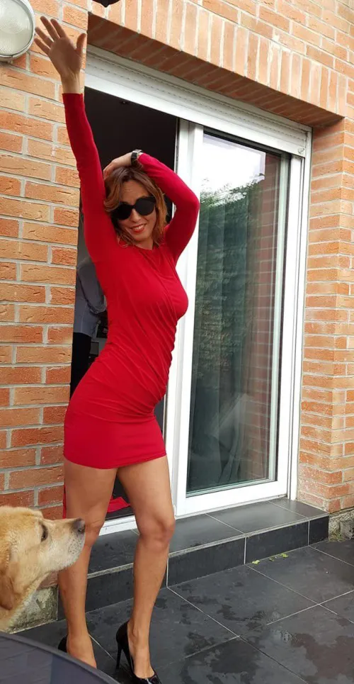 Older woman in a red dress enjoying life