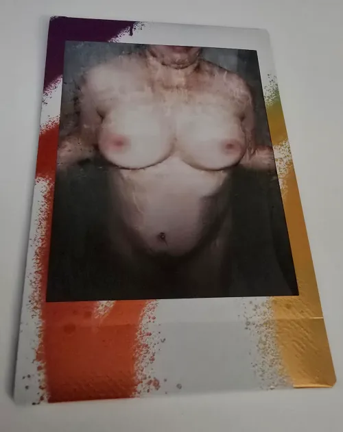 Instax mini 12 capture of my wife's tits in the shower.