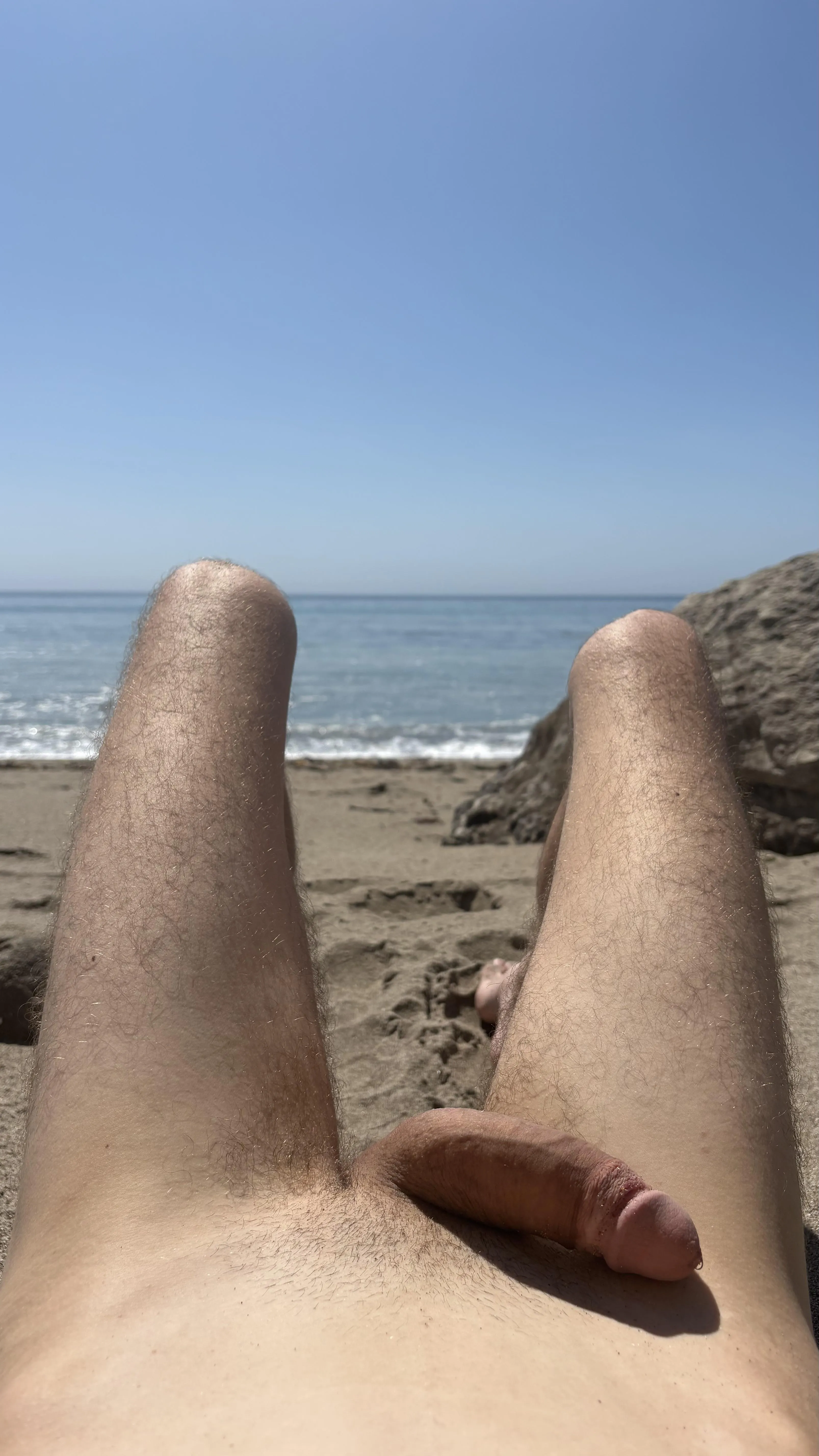 Dripping precum at my first nude beach 😇