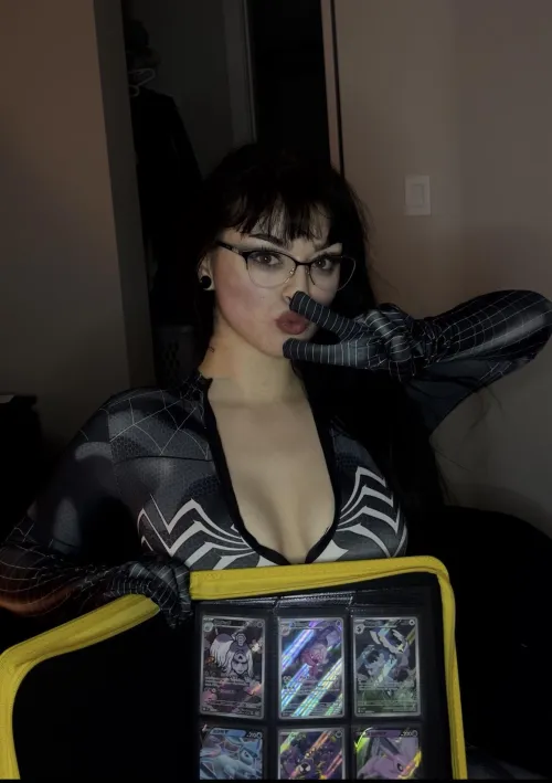 what do u prefer, the spider woman costume or my card collection?