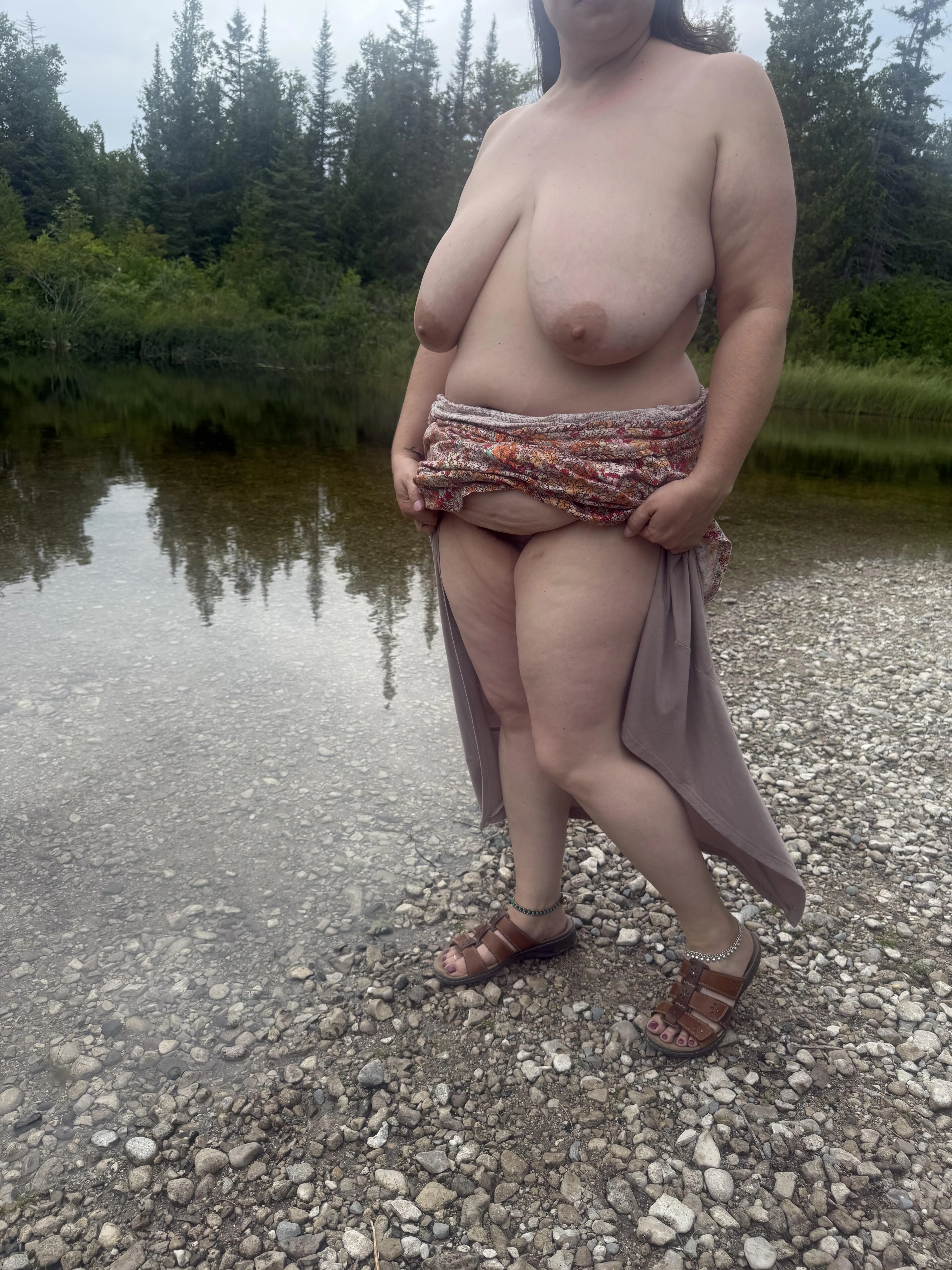 Her clothes coming off again outdoors