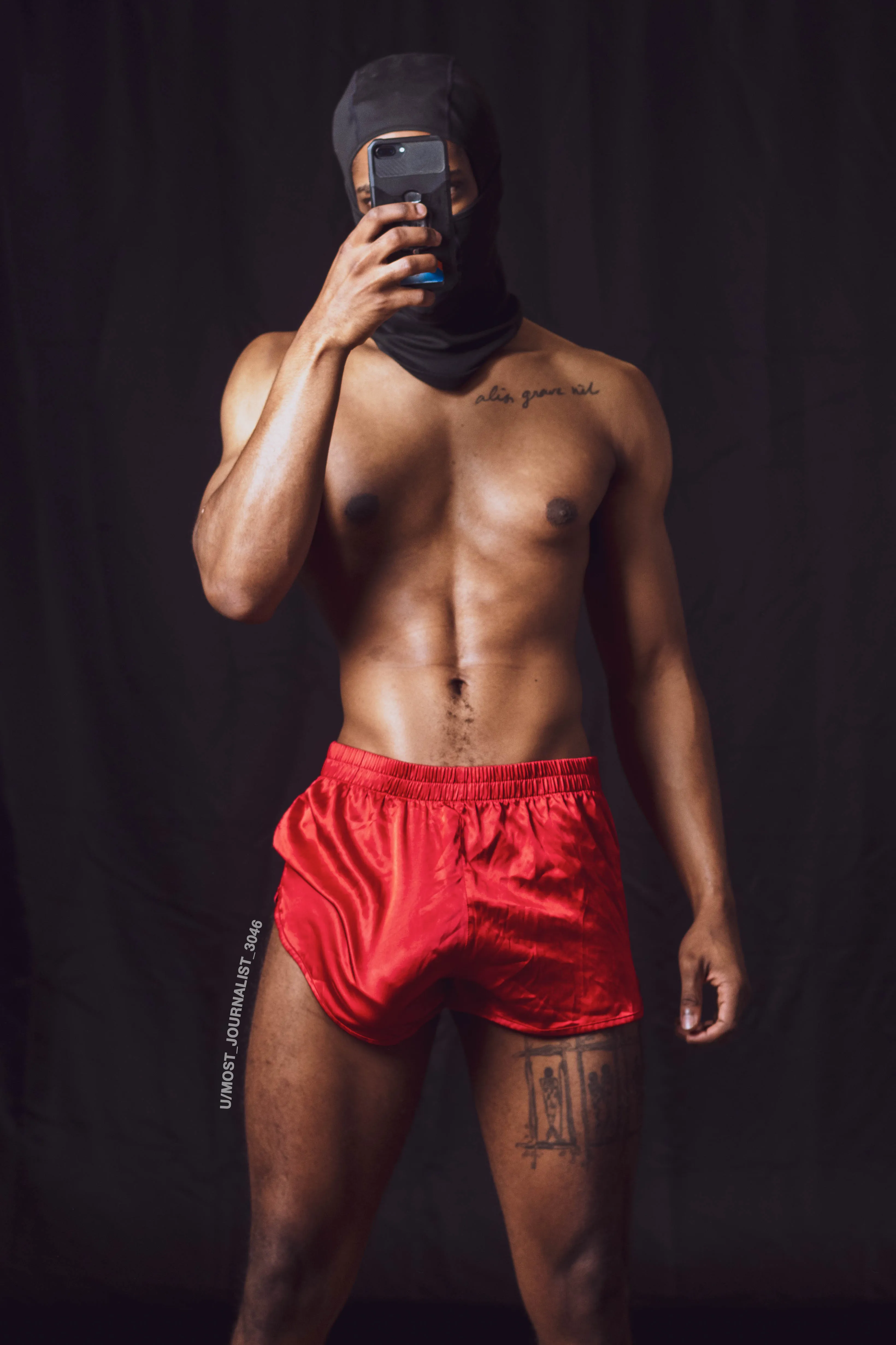 Red shorts. Heavy bulge. This isn’t thirst trap — this is your new religion.