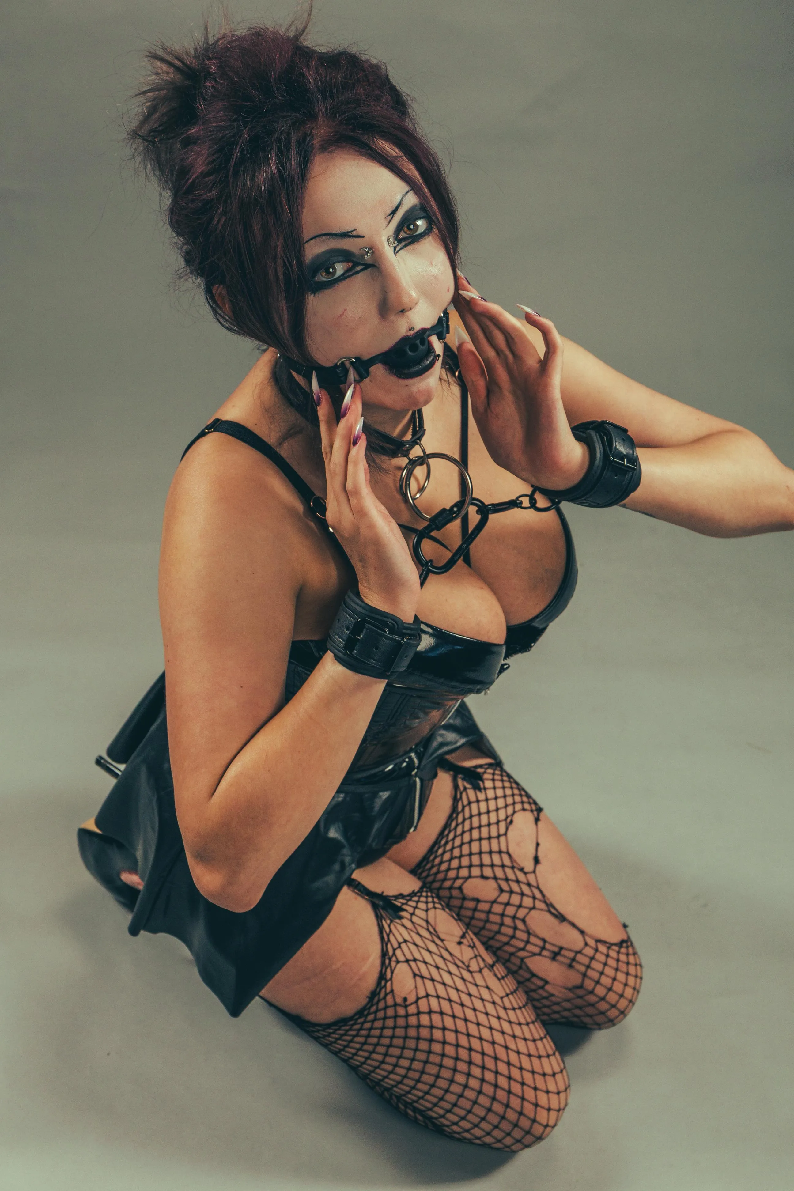 Gagged and cuffed in PVC