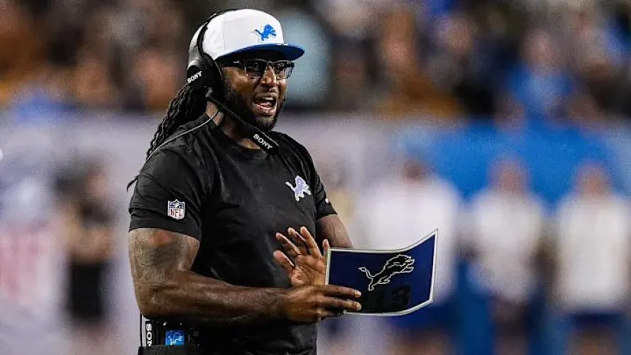 Lions Defensive Coordinator Kelvin Sheppard looks like he's a waiter at Andre's Steakhouse.