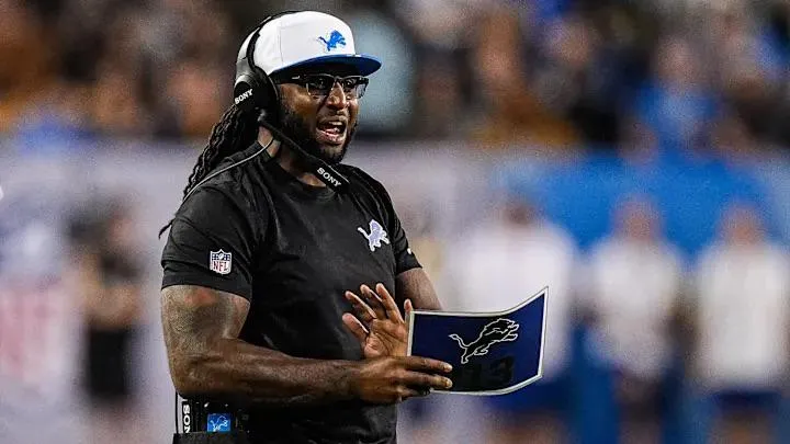 Lions Defensive Coordinator Kelvin Sheppard looks like he's a waiter at Andre's Steakhouse.