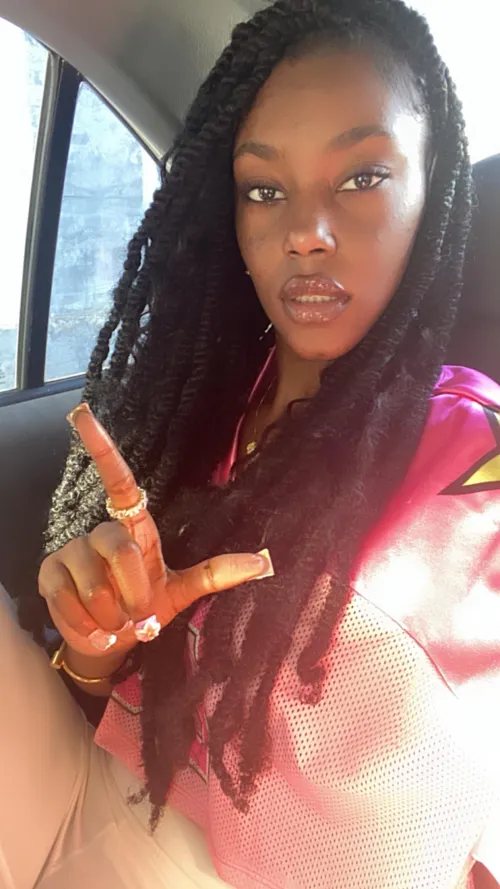 I hold the L so you remember your place, beneath every Black Goddess who rewrites your world.