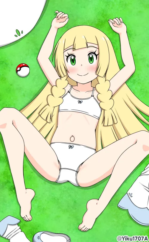 Lillie laying in the grass