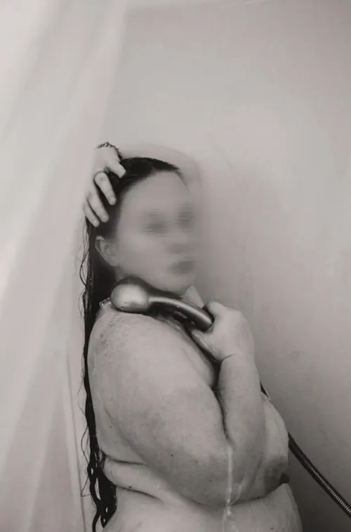 Overexposed shower nude portrait of a plus size goddess.