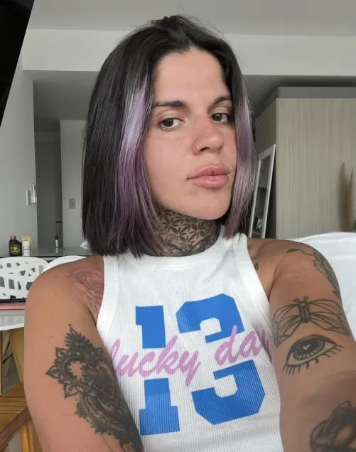 Short hair and purple highlights for added pleasure